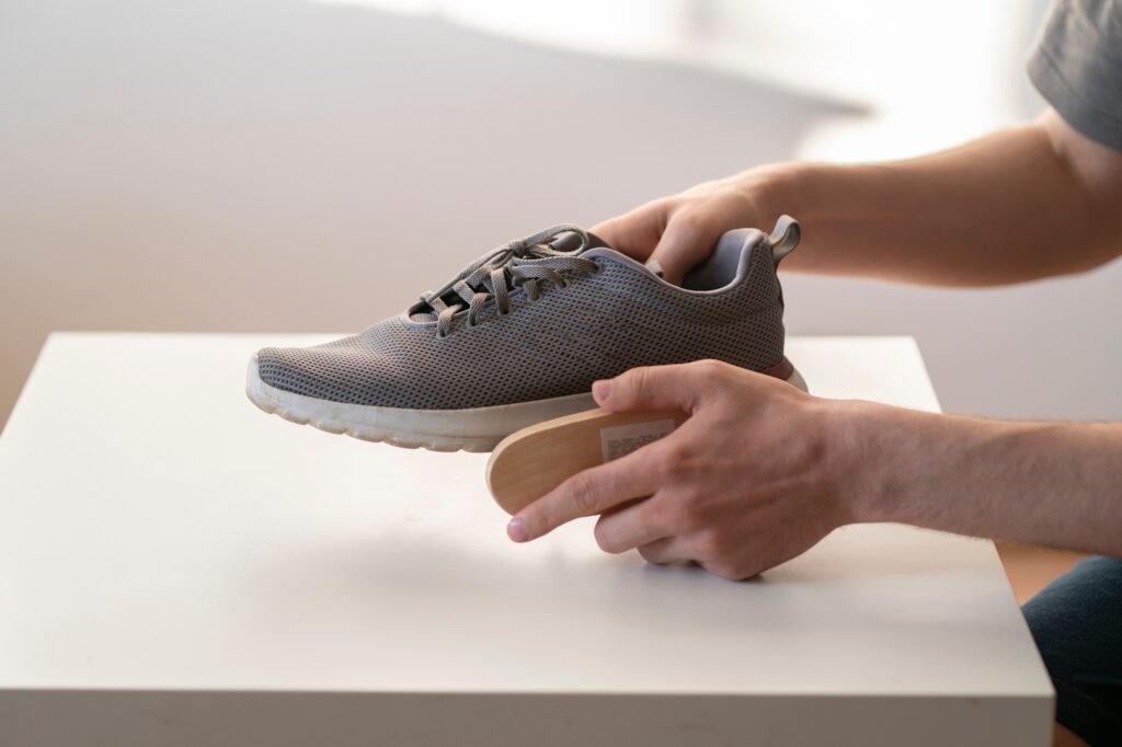 washing sneakers with special brush tool, dirty shoes cleaning